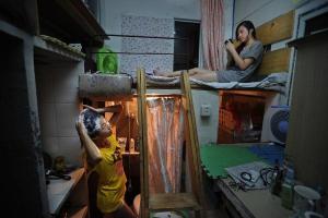 Kapsulės apartamentai Kinijoje, arba kaip išgyventi dėžutę iš po šaldytuvo